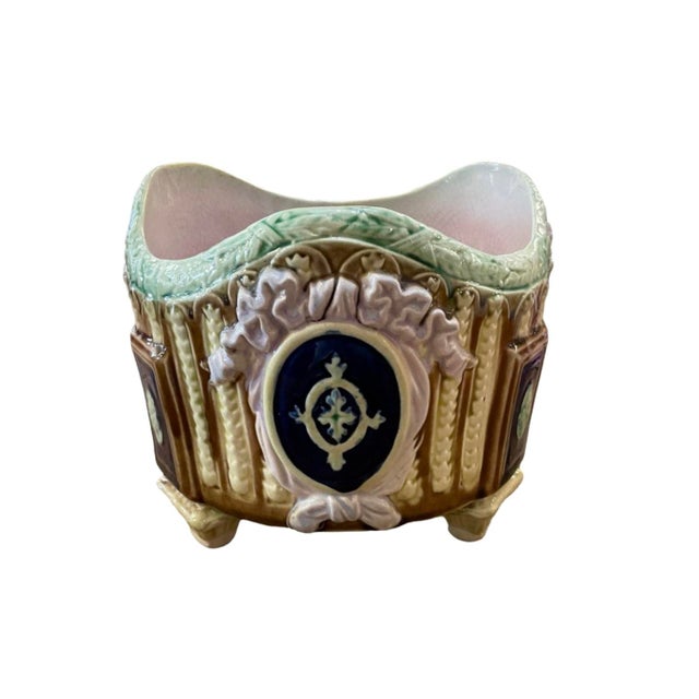 Late 19th Century Footed Brown and Yellow Majolica Planter. Cobalt Medallions Around Piece. Lavender Bow Detail on Front...