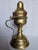 This is a religious artifact is used in the liturgical practices for burning charcoal incense. It features a pedestal base...