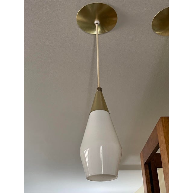 Three individual tear drop pendant lights purchased in 1962, one owner. Danish style design, Opaline glass globes from Moe...