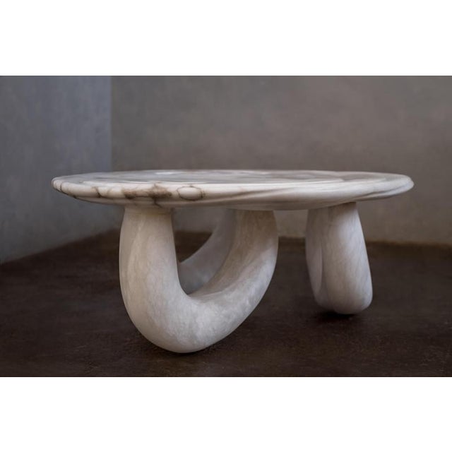 Aqua fossil center table ii in alabaster by amarist studio one of a kind dimensions: d 77 x w 125 x h 48 cm. Materials:...