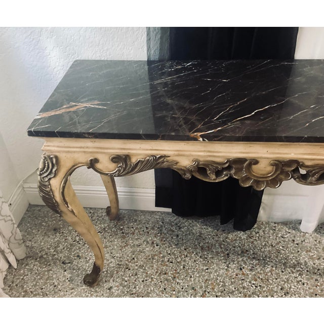 Elegant and timeless, this vintage French Provincial console table brings classic European sophistication to any entryway,...