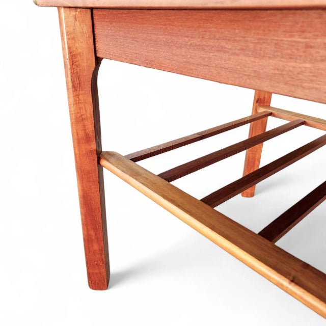 Presenting an exceptional piece of certified Danish Modern history: an authentic teak side table by the recognized maker...