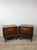 This pair of mid century modern nightstands by United Furniture Co. features hardwood construction, original walnut...