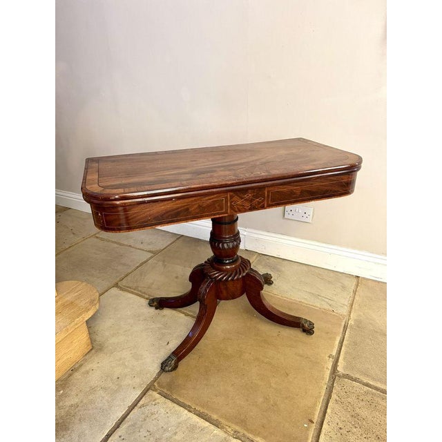 Wonderful antique Regency quality mahogany inlaid tea table, having a quality Regency mahogany tea table with a...