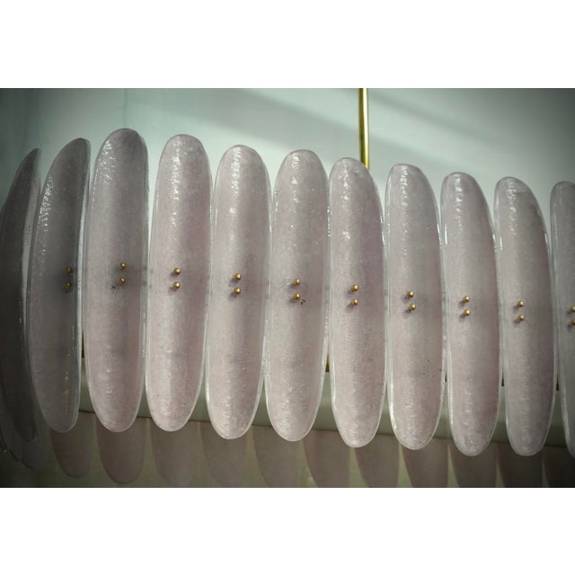 Murano chandelier with an elongated design with brass structure and single pink glass. The glass half-shell is very...