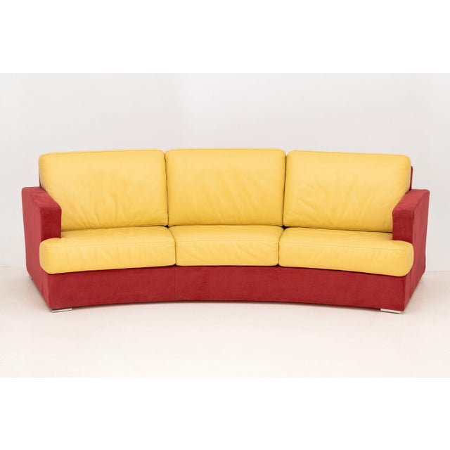 Rolf Benz Curved Two-Tone Three-Seat Sofa, in red suede and tan leather upholstery. 32" H x 108" W x 36" D; seat: 16" H....