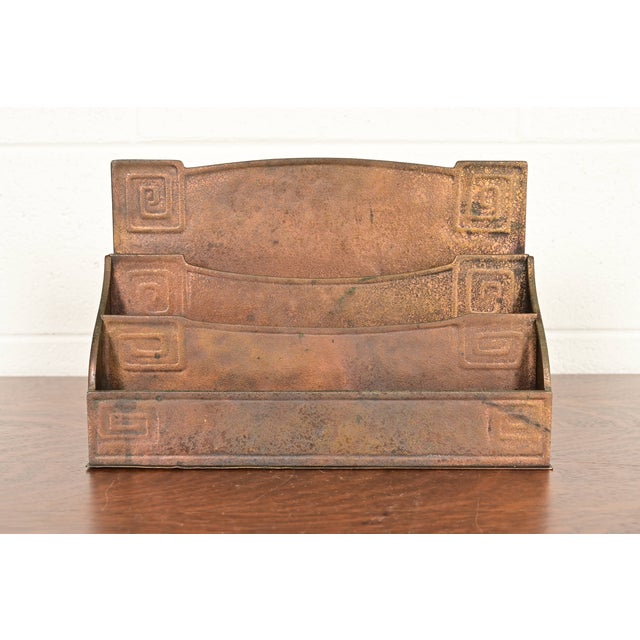 A gorgeous antique Art Deco period bronze desk letter rack featuring a Greek key design By Tiffany Studios (signed to the...