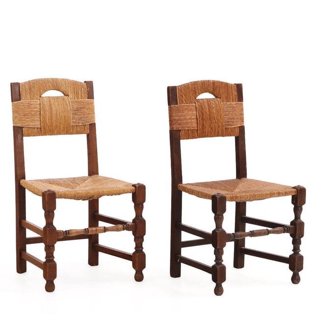 A wonderful set of ten French rustic modern/Art Deco dining chairs in the manner of Charles Dudouyt, each with a tall rush...