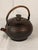 An attractive antique Himalayan/Tibetan copper tea or water kettle, of rounded form with a removable domed lid, short...
