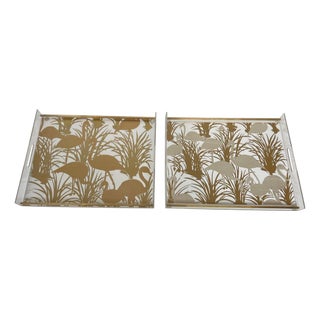 Pair of Lucite and brass trays decorated with gilded birds For Sale