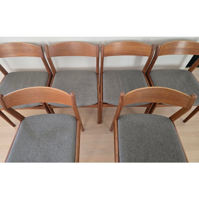 Set of six authentic Danish Modern teak dining chairs, made in Denmark circa 1960s. These beautifully crafted chairs...