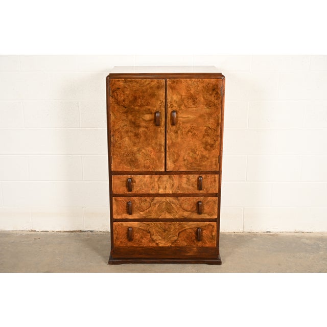 A beautiful antique Art Deco period burl wood armoire dresser, gentleman's chest, or linen press In the manner of Donald...