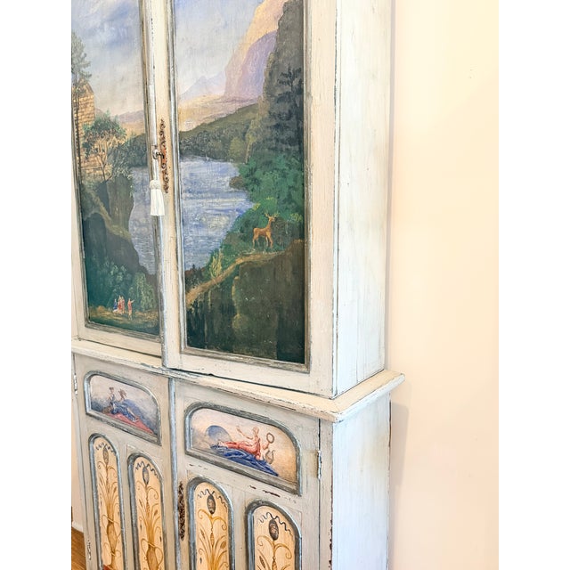 A beautifully executed early 20th century Italian painted cabinet, distinguished by its richly decorated surfaces and...