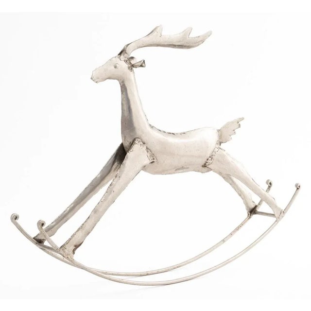 Rocking Reindeer Metal Sculpture. 15.25" H x 19.5" W. Provenance: From a New York City Collection.