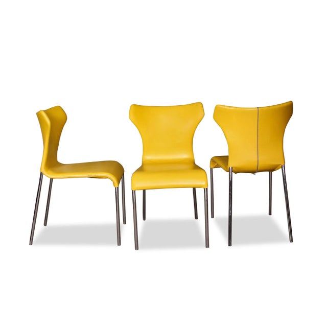 Curvy chairs with a zipper detail on their back, comfortable and chic, Papilio means butterfly in Latin, and the piece has...