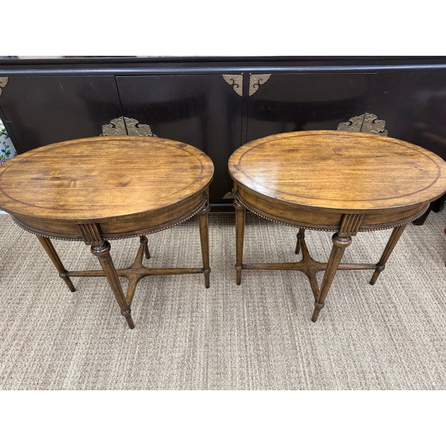 This pair of side tables is from the high end "Acquisitions" Collection by Henredon. They are designed with inlay detail...