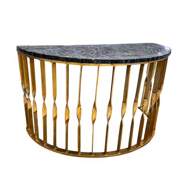 A rare find, quite literally — this hemisphere accent table is carved from genuine Blue Tiger Eye, a semiprecious stone...