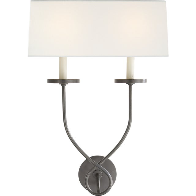 Symmetric Twist Double Sconce in Bronze with Linen Shade Designer: Chapman & Myers Finish: Bronze Height: 20.25" Width:...