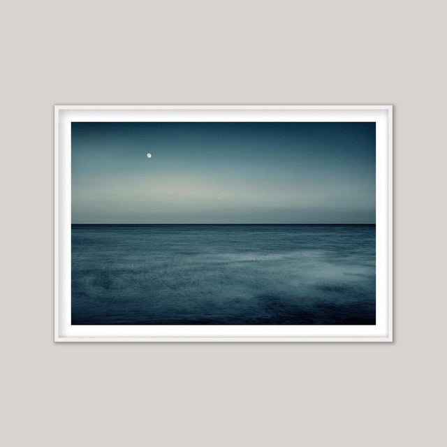 Moonrise III, Selsey - a long-exposure photograph capturing twilight’s quiet transformation as the moon ascends over the...