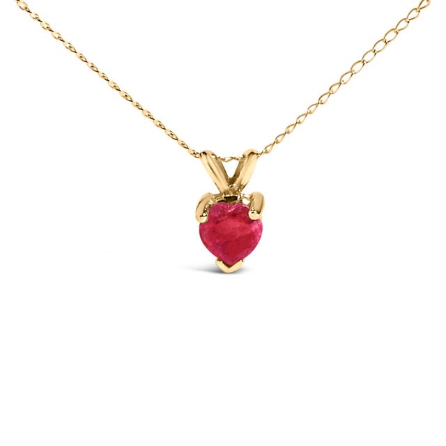 Evoke the essence of eternal elegance with this captivating pendant necklace, featuring a heart-shaped ruby, a symbol of...