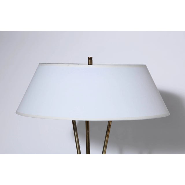 Early Gerald Thurston for Lightolier Brass Tripod Reading Floor Lamp with White Linen Shade. Featuring a joined tripod,...