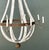 This vintage rustic chandelier embodies the character of timeworn craftsmanship, pairing weathered wood with hand-forged...
