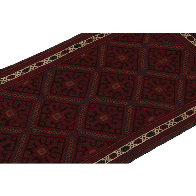 Hand knotted in wool, this 3x4 Baluch scatter rug represents a new line of tribal carpets in the Modern Classics...