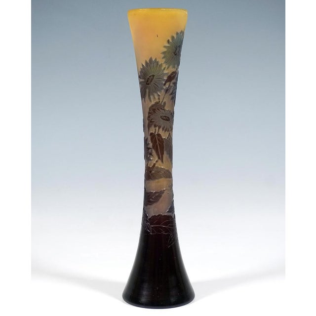 Tubular vase with an inwardly concave wall on a flush base, colourless glass with milky yellow-orange powder fusions,...