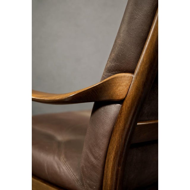 This modernist armchair was produced by the Danish manufactory Farstrup Møbler during the 1970s. The frame is made of...