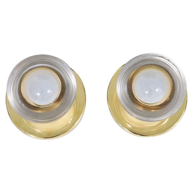 Pair of sconces with Murano glass cup shades and brass hardware. Light bulbs not included.