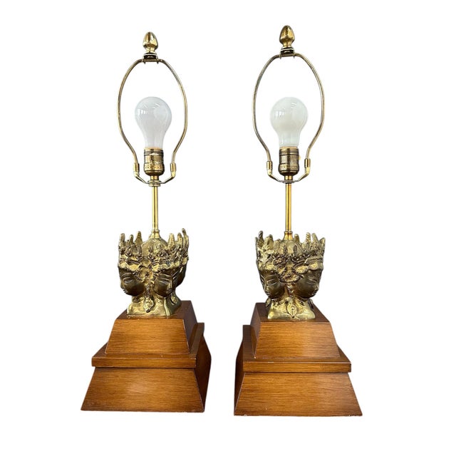 These unique table lamps feature an elegant blend of brass and mahogany, influenced by Asian design. With their...