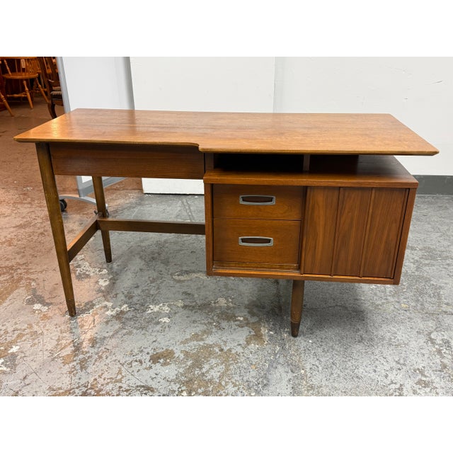 Design Plus Gallery presents a Vintage 1970s Mainline Collection Two-Tiered Walnut Desk from Hooker Furniture. The desk...
