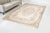 This is a vintage Turkish Oushak rug from the Mid 20th Century. The piece was hand-knotted.