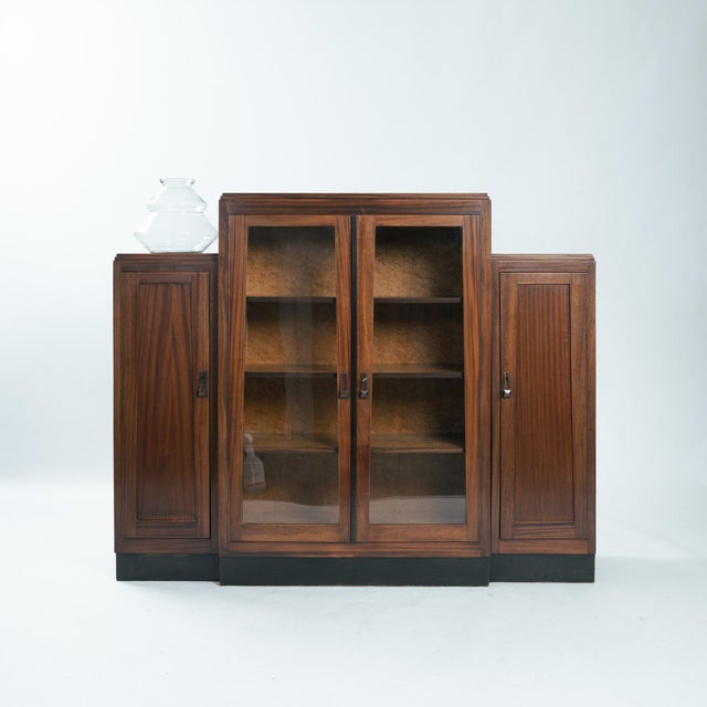 An exceptional Amsterdam School Art Deco cabinet from the Netherlands, crafted in richly figured walnut and dating from...