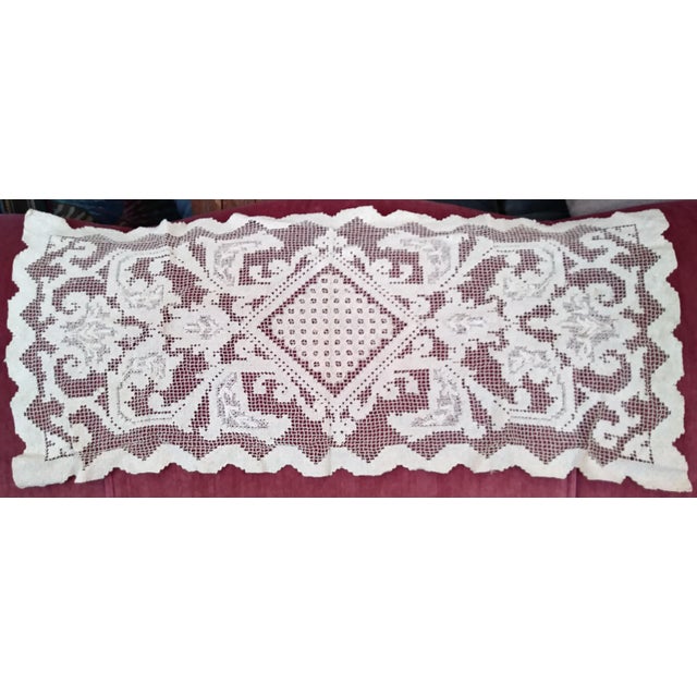 Elaborately handworked Victorian cotton-thread table runners and doilies. Variety of shapes and sizes. Some yellowed and...