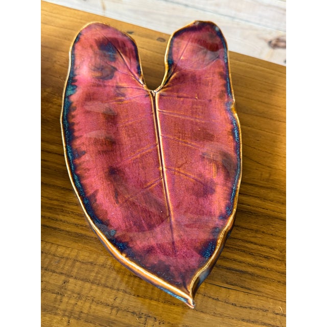 A striking pair of handcrafted studio pottery leaf form trays signed and dated 2017. Finished in a rich oxblood glaze with...