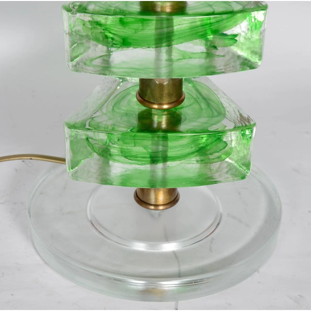 This set of two table lamps features green Murano glass discs mounted on gold stands. Up to 250V (Europe/UK Standard).The...