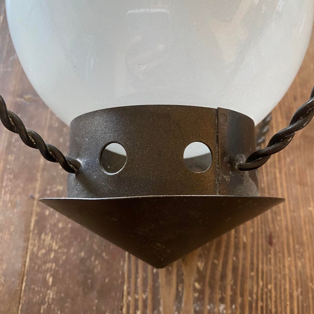 Perforated metal lantern/pendant light in the style of Mathieu Matégot. Dating from the 1950s, it shows minor signs of...