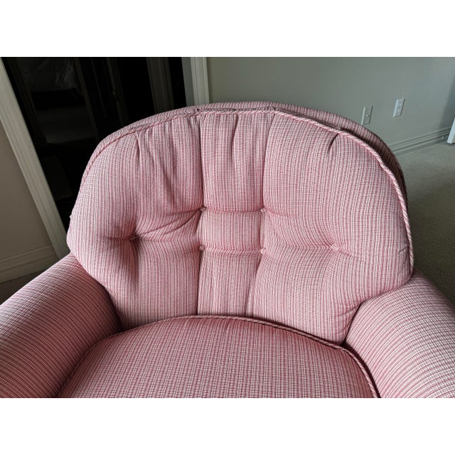 Features a generously proportioned, rounded back with classic button-tufting on the interior, rolled arms, a deep seat,...