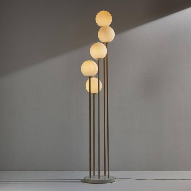 Metal floor lamp with exciting shapes and five glass shades from the 1980s. The glass and metal parts of the lamp have...