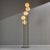 Metal floor lamp with exciting shapes and five glass shades from the 1980s. The glass and metal parts of the lamp have...