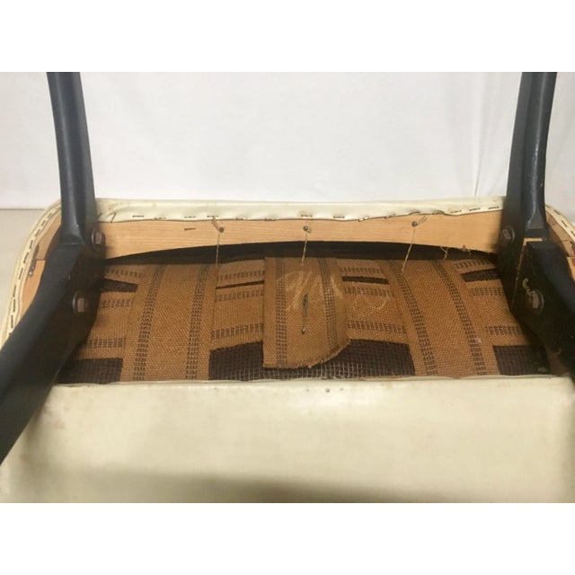 Milo Baughman style scoop chair with original white vinyl in a textured diamond pattern. Painted black wood legs. The legs...