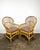 Vintage pair of bamboo/rattan fan back arm chairs. Made in Philippines. Pencil reed backs with triple band trim around...