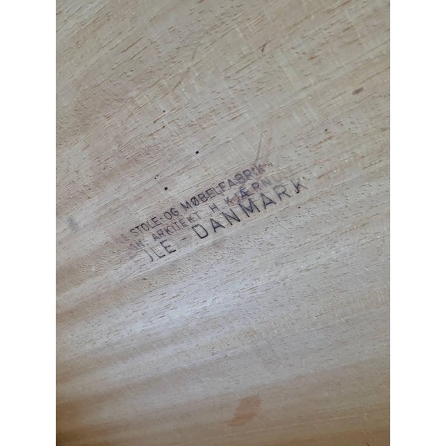 Beautiful vintage Danish teak extendable dining table featuring clean mid-century modern lines and a rich natural grain....