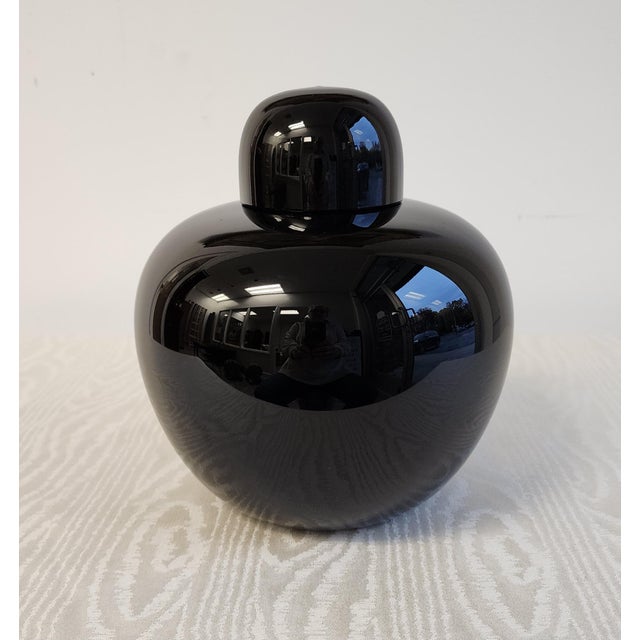 A captivating Oriental-inspired silhouette, this impressive black vase belongs to Tobia Scarpa's Opaco Collection,...