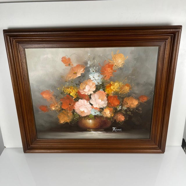 Vintage decorative painting depicting a floral still life, signed Frederik. This oil painting, with its warm and luminous...
