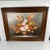 Vintage decorative painting depicting a floral still life, signed Frederik. This oil painting, with its warm and luminous...
