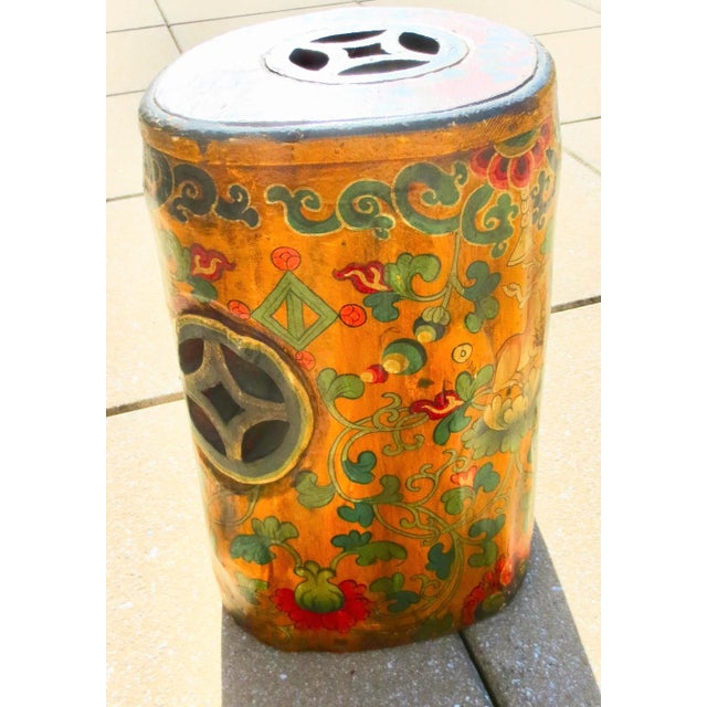 Tibetan Buddhist painted stool. Hand-carved from a tree trunk, with a hand-hollowed core and natural tree form on the...