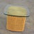 Handsome Coastal, Island, or organic modern rattan wicker side table or end table having a ½ inch thick glass top with an...