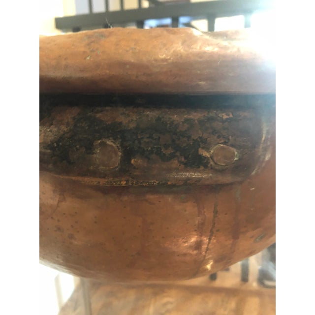 Antique French copper mixing bowl. This thing is massive and heavy. Hand hammered iron handles. Stunning in a collection...